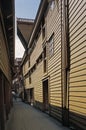 A narrow alleyway with wooden buildings in Bryggen, Bergen, Norway.